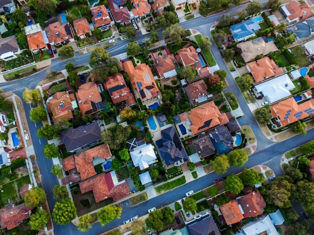 Rooftops of a row of suburban houses viewed from above