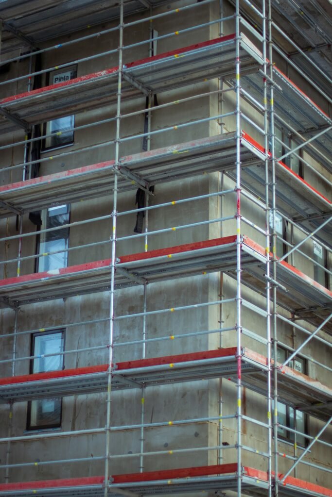 Scaffolding erected against an apartment building facade during remediation works