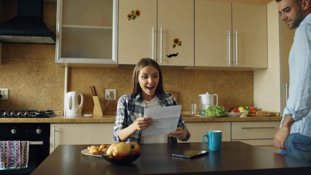 Australian couple reviewing a property document together at their kitchen table