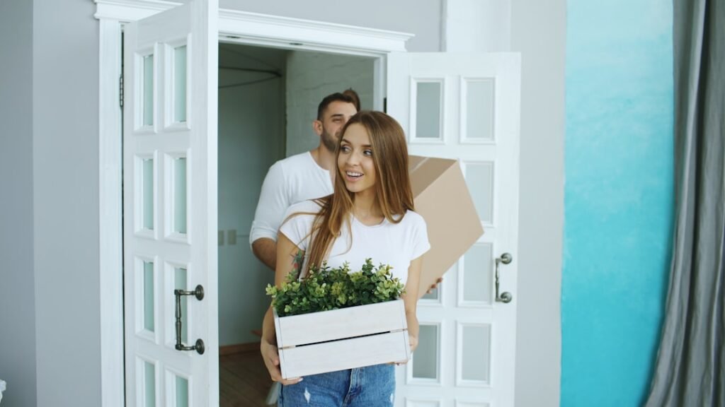 Couple walking through their new house after relocating