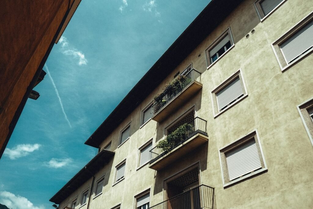 Apartment building facade against a blue sky, typical of an Australian strata scheme