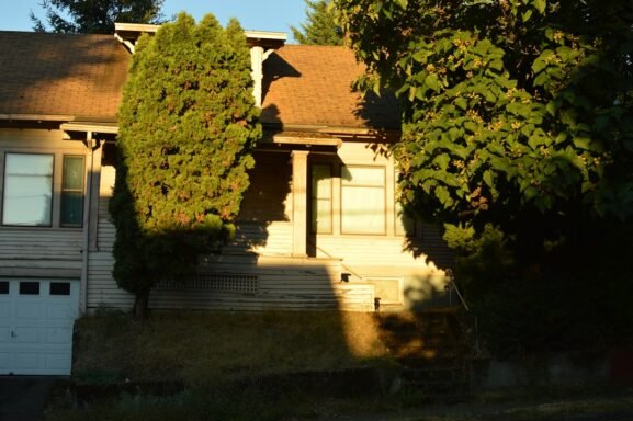 Suburban house with a garage in golden-hour light